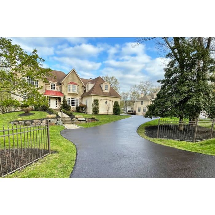 Fresh asphalt coating on a finished driveway