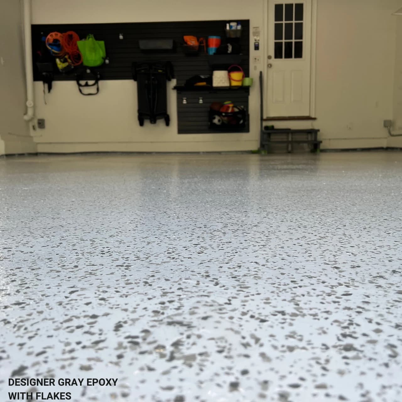 Renewed garage floor with flake epoxy coating